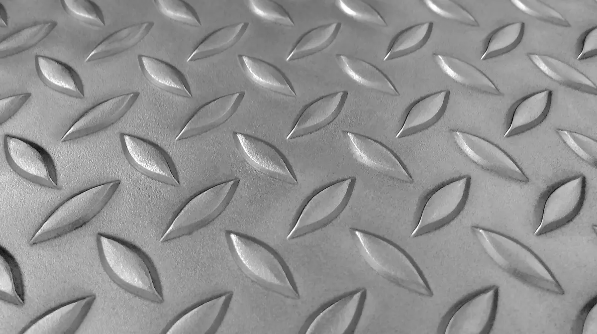 Stainless steel checkered sheet with flat protrusions