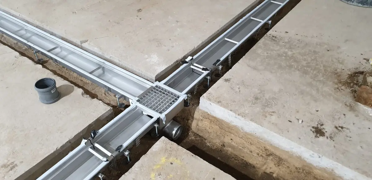 Floor renovations - installation of drainage channels with heavy-duty ladder covers