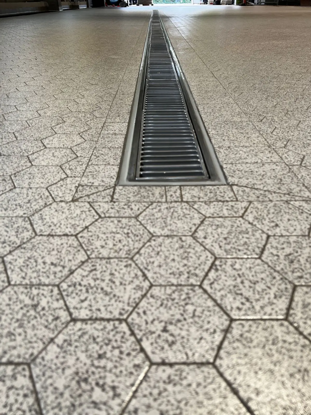 Drainage channel with a width of 200 mm and ladder cover in a German brewery