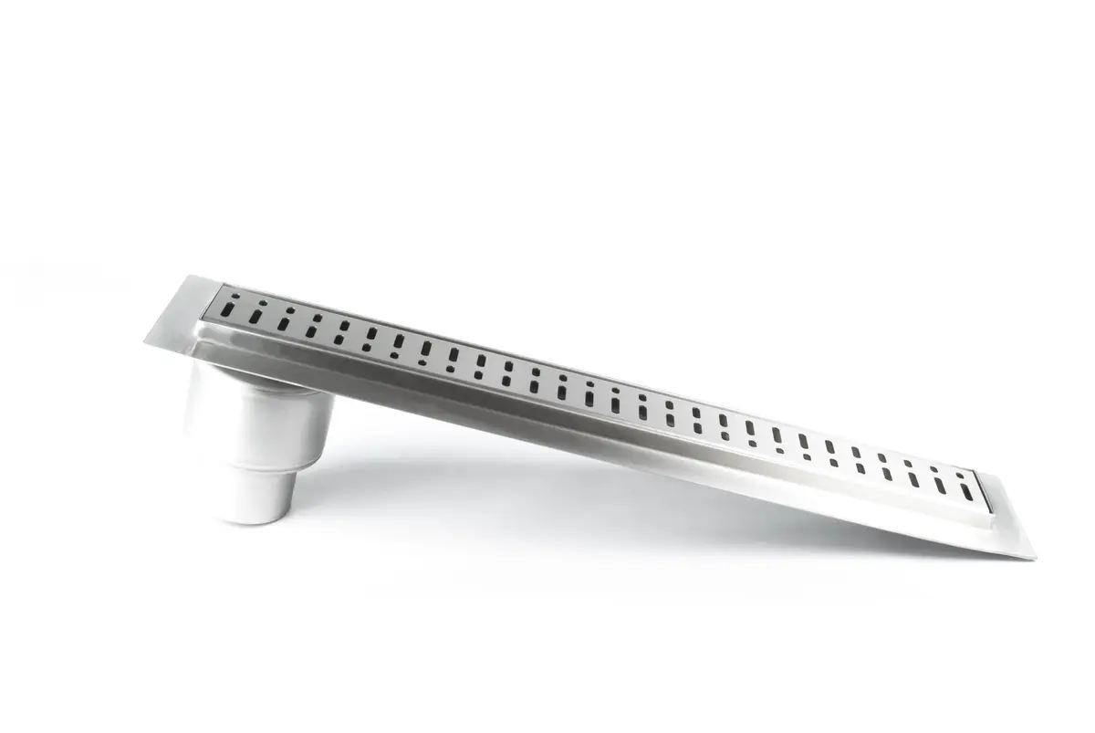 Linear shower drains with vertical outlet